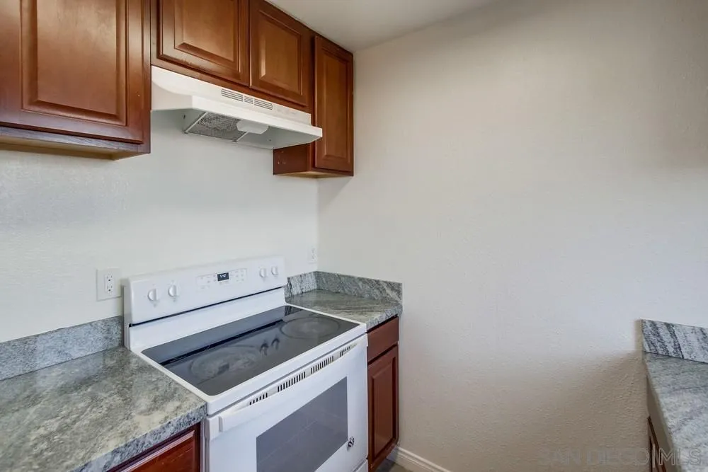 300 Filbert Street, Unit 2 El Cajon, CA 92020 - Photo 16 of 35 a kitchen with a stove and cabinets