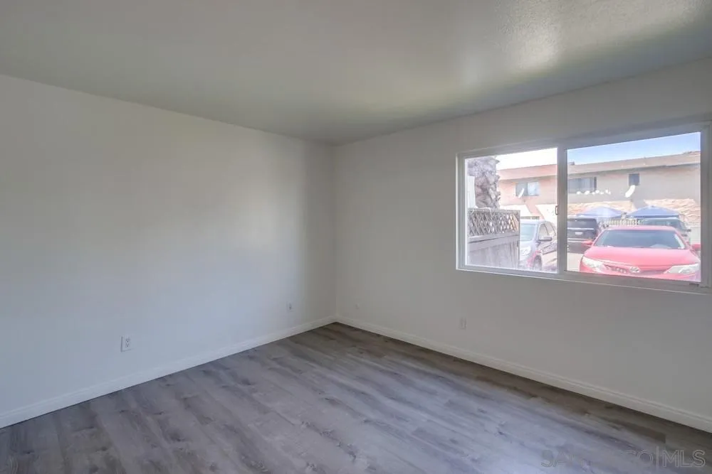 300 Filbert Street, Unit 2 El Cajon, CA 92020 - Photo 21 of 35 an empty room with wooden floor and windows
