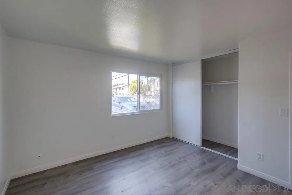 300 Filbert Street, Unit 2 El Cajon, CA 92020 - Photo 23 of 35 an empty room with wooden floor and windows