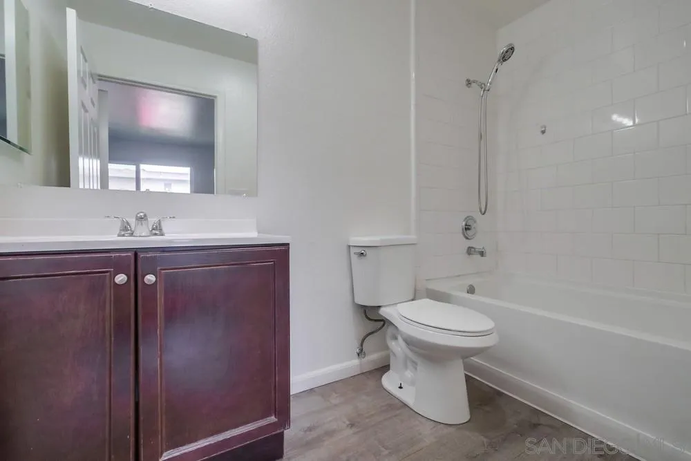 300 Filbert Street, Unit 2 El Cajon, CA 92020 - Photo 25 of 35 a bathroom with a sink toilet and a mirror