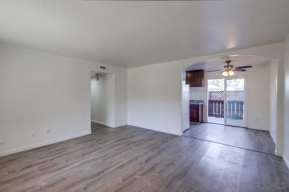 300 Filbert Street, Unit 2 El Cajon, CA 92020 - Photo 8 of 35 an empty room with wooden floor and windows