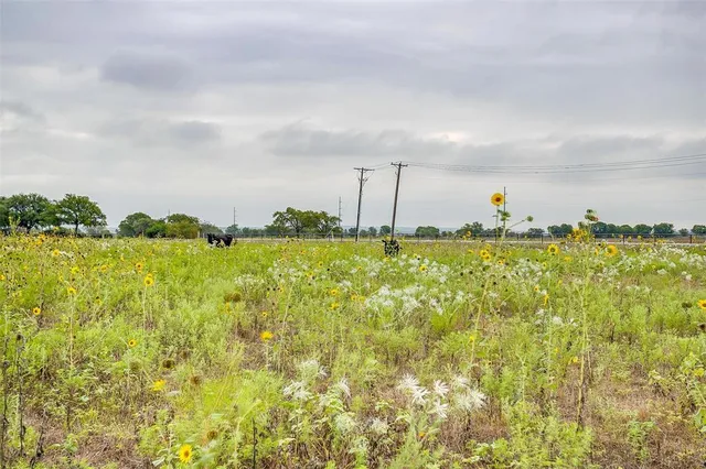 a view of a large body of water with a building in the background