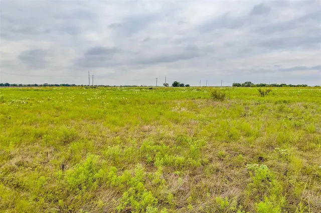 a view of a lake with a big yard