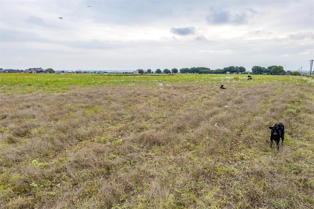 12700 West Rocky Creek Road Crowley, TX 76036 - Photo 32 of 39 a view of a lake with a big yard
