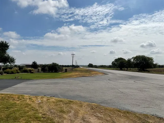 a view of a lake and yard