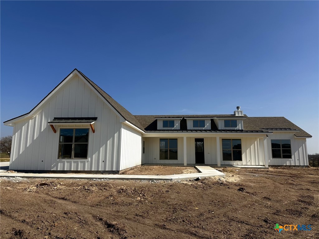 front view of a house with a rug