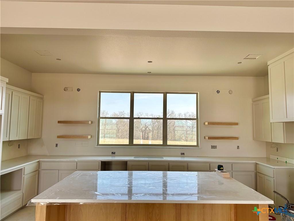 16033 Honey Ridge Drive Holland, TX 76534 - Photo 3 of 7 a kitchen with a window a sink and a cabinets