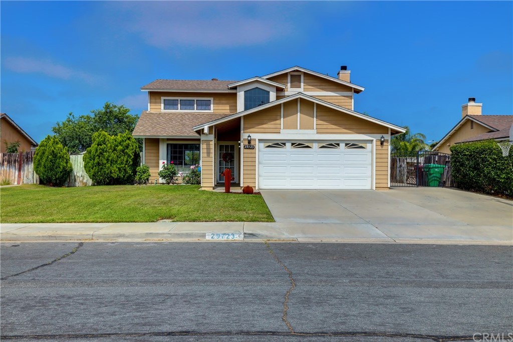 29723 Melitta Road Menifee, CA 92584 - Photo 1 of 1 a front view of a house with a yard
