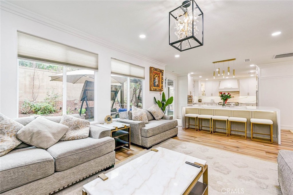 2 Dos Rios Irvine, CA 92602 - Photo 7 of 64 a living room with furniture wooden floor and kitchen view