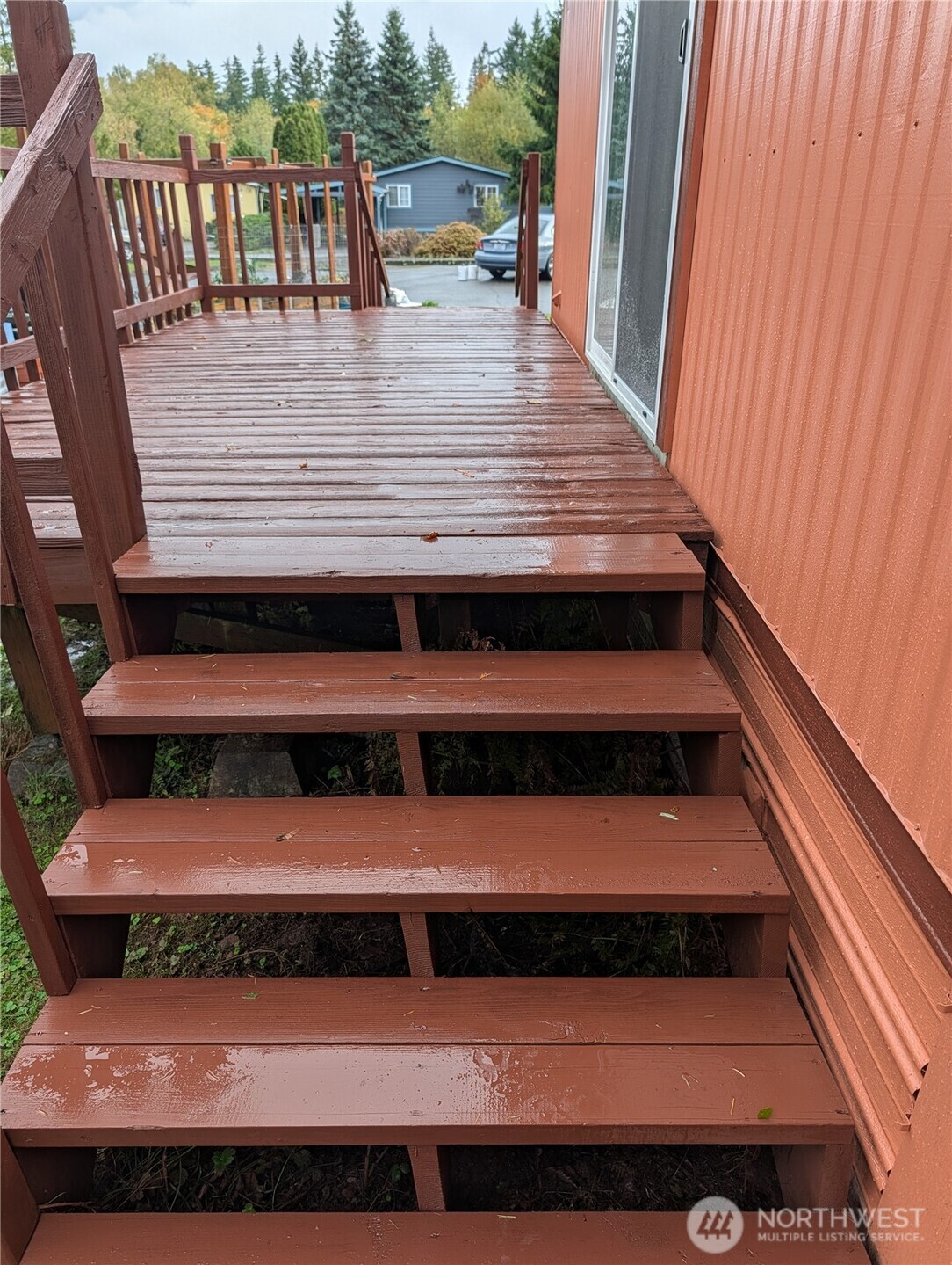 4000 Flynn Street, Unit 50 Bellingham, WA 98229 - Photo 11 of 15 a view of a balcony with wooden floor and outdoor seating