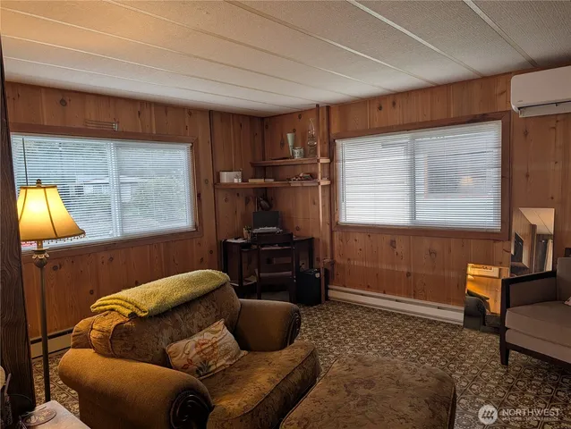 a livingroom with furniture and a window