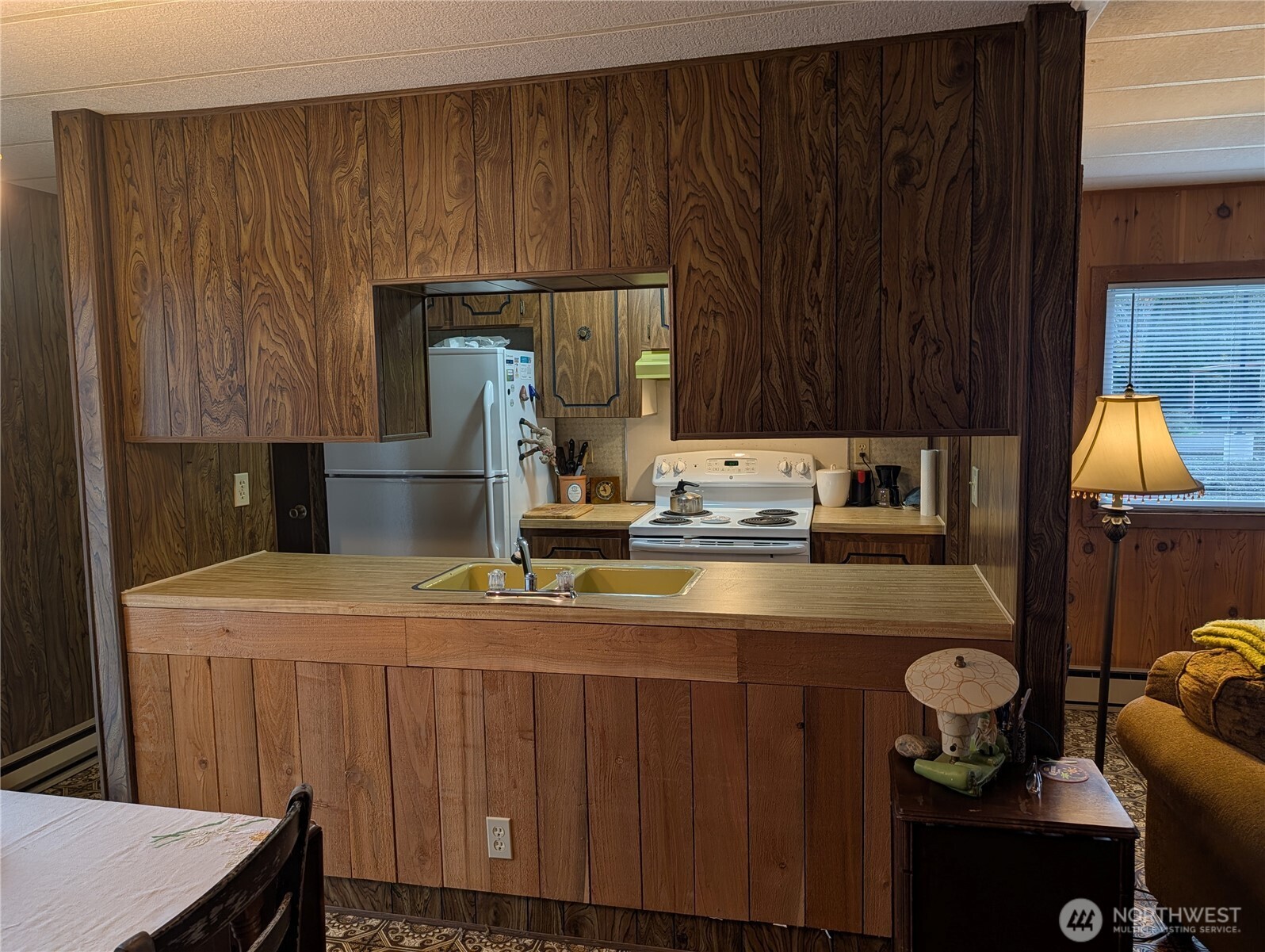 4000 Flynn Street, Unit 50 Bellingham, WA 98229 - Photo 4 of 15 a kitchen with kitchen island a sink cabinets and appliances