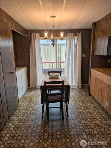 a room with furniture and a chandelier