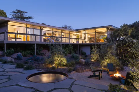 a view of a chairs and table in the patio