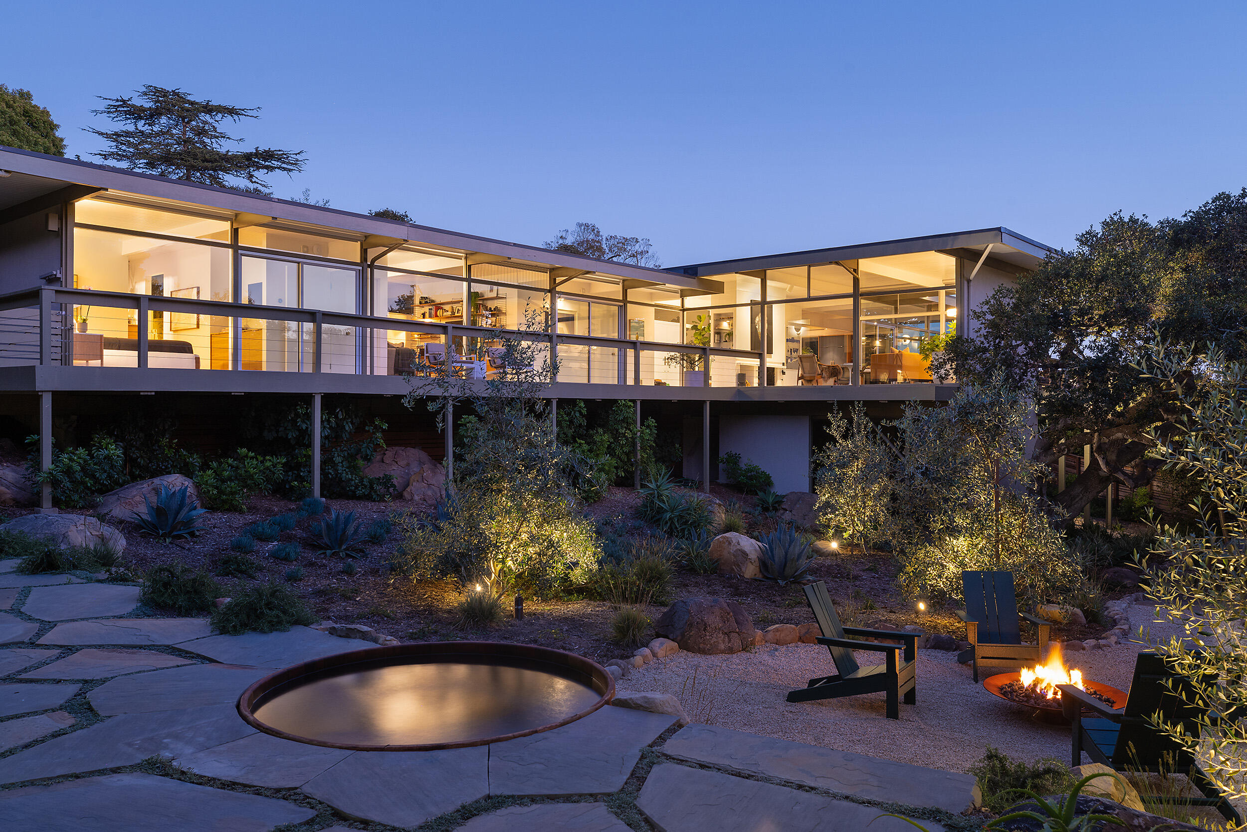 a view of a chairs and table in the patio