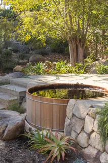a wooden bench sitting in a backyard