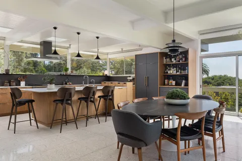 a view of a dining room with furniture window and outside view