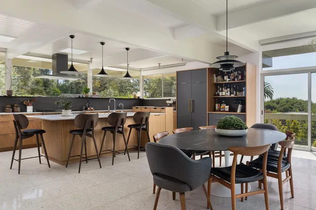 a view of a dining room with furniture window and outside view