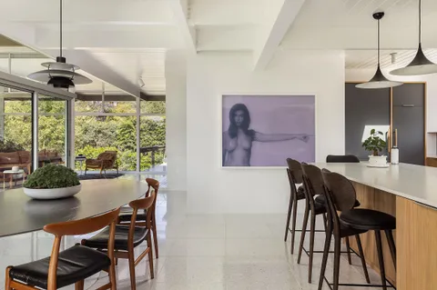 a dining room with furniture and window