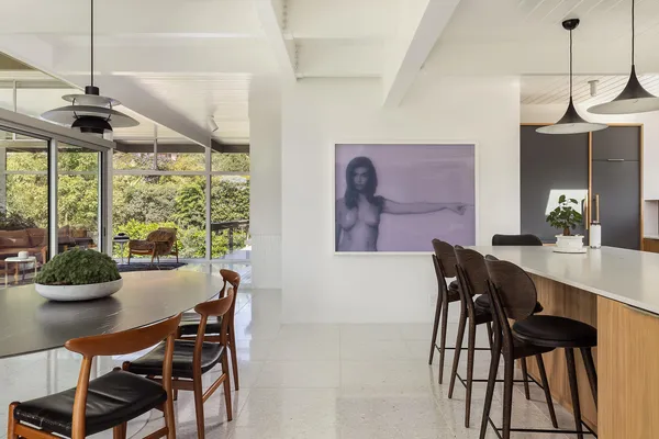 a dining room with furniture and window