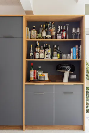 a room with wine cabinets and a floor to ceiling window