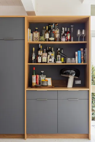 a room with wine cabinets and a floor to ceiling window