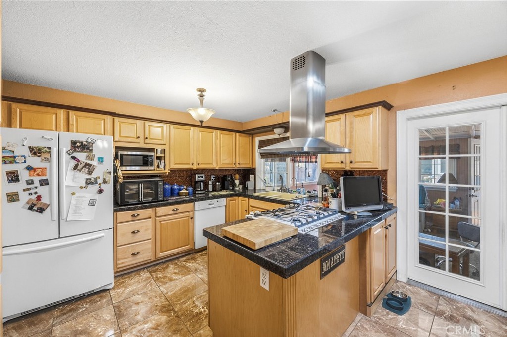 1539 Robyn Street Redlands, CA 92374 - Photo 15 of 47 a kitchen with stainless steel appliances granite countertop a sink stove and refrigerator