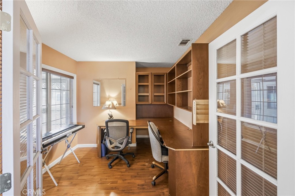 1539 Robyn Street Redlands, CA 92374 - Photo 21 of 47 a view of workspace with wooden floor and windows