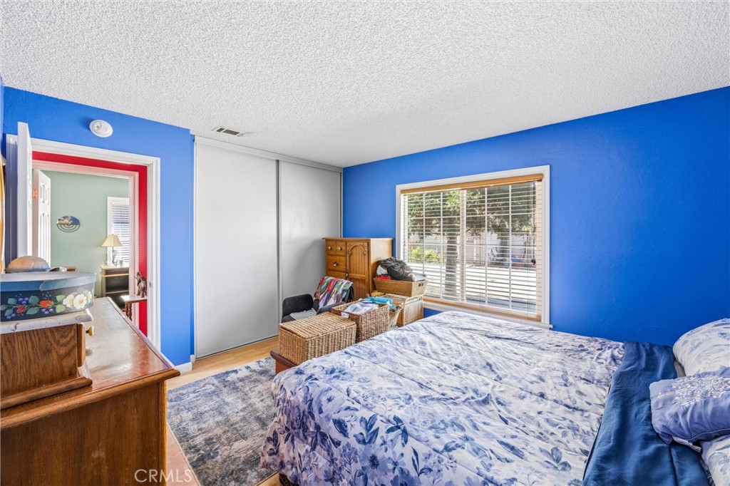 1539 Robyn Street Redlands, CA 92374 - Photo 27 of 47 a bed room with a bed and a chair