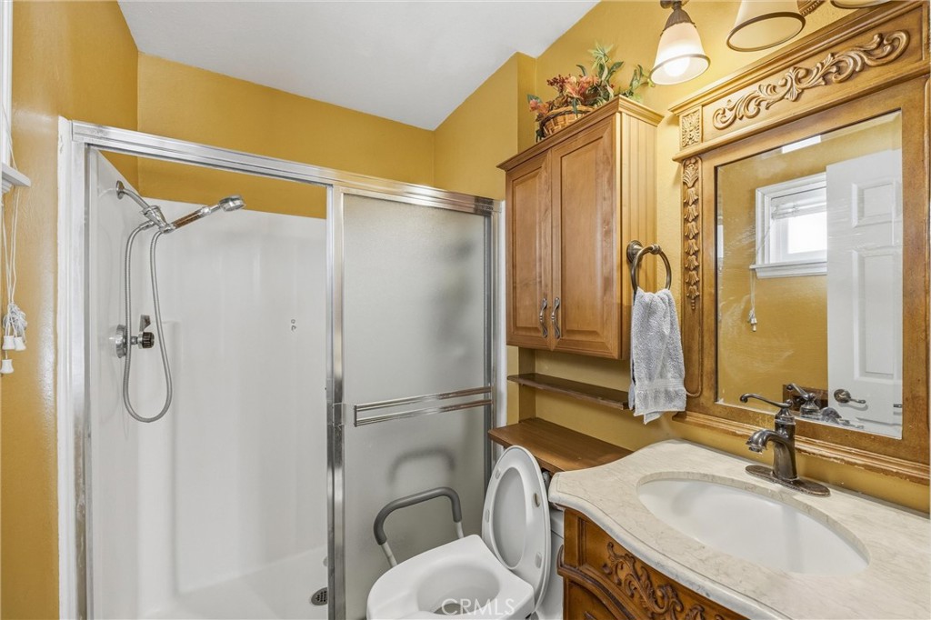 1539 Robyn Street Redlands, CA 92374 - Photo 28 of 47 a bathroom with a sink toilet and shower