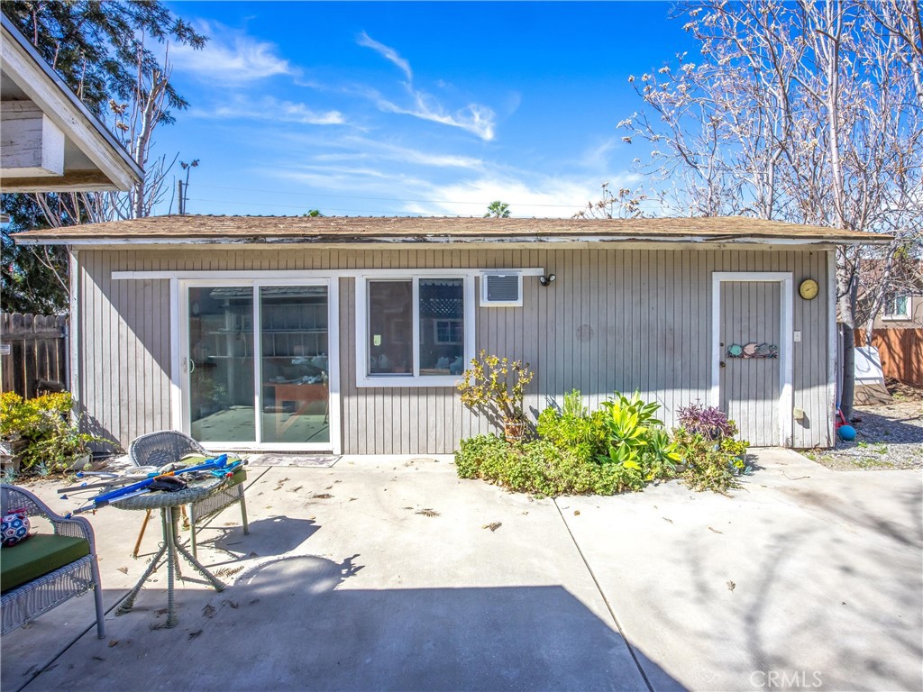 1539 Robyn Street Redlands, CA 92374 - Photo 32 of 47 a front view of a house with a yard and potted plants