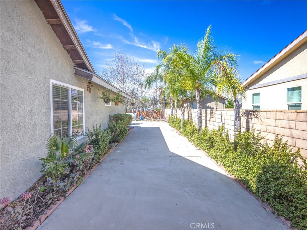 1539 Robyn Street Redlands, CA 92374 - Photo 39 of 47 a view of a house with a big yard and potted plants