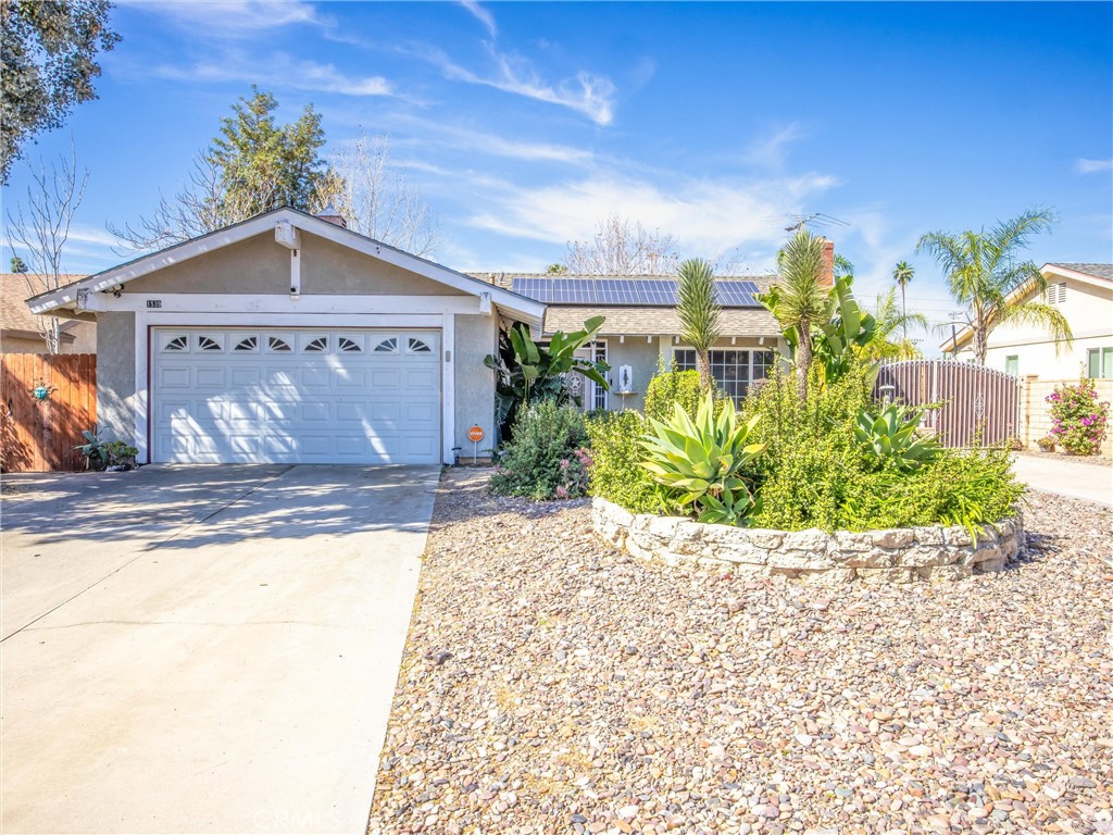 1539 Robyn Street Redlands, CA 92374 - Photo 6 of 47 a view of a house with a small yard and potted plants