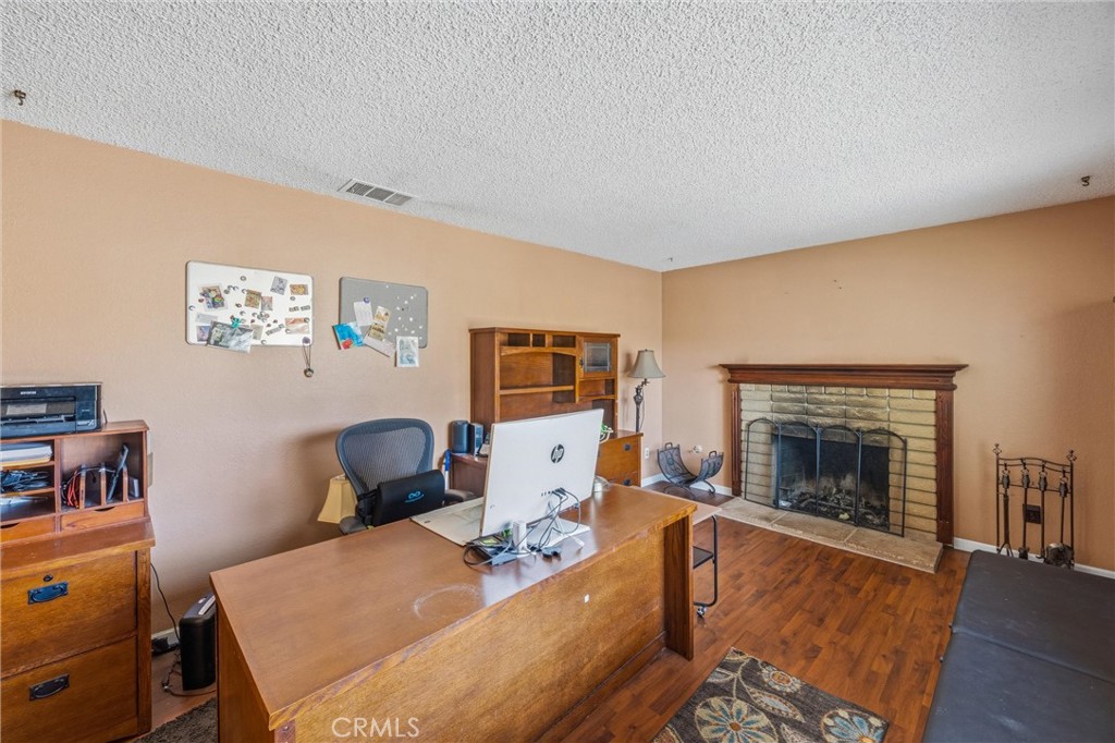1539 Robyn Street Redlands, CA 92374 - Photo 7 of 47 a living room with furniture and a fireplace
