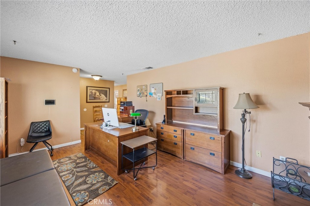 1539 Robyn Street Redlands, CA 92374 - Photo 8 of 47 a room with furniture and wooden floor