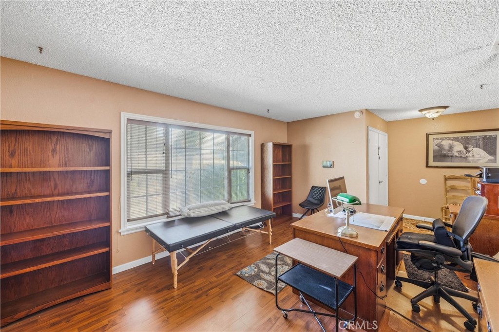 1539 Robyn Street Redlands, CA 92374 - Photo 9 of 47 a living room with furniture a table and wooden floor