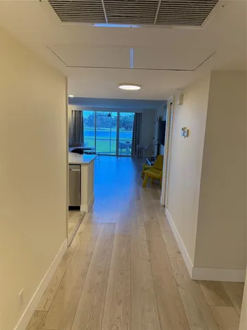 a kitchen with stainless steel appliances a sink stove and cabinets