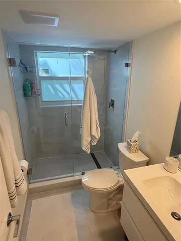 a kitchen with stainless steel appliances a refrigerator and a sink