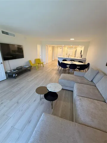 a living room with furniture and a table