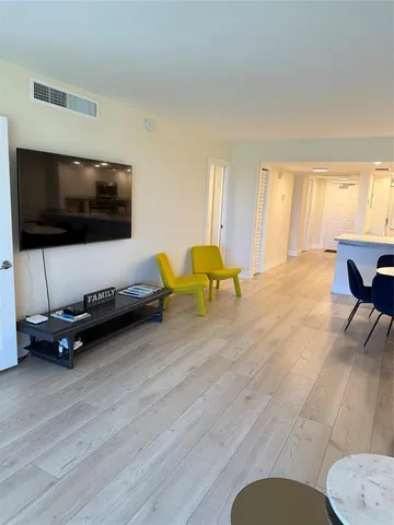 a spacious bedroom with two beds and window