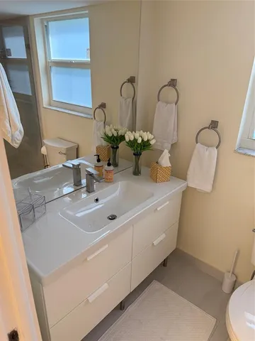 a bathroom with a toilet and a sink