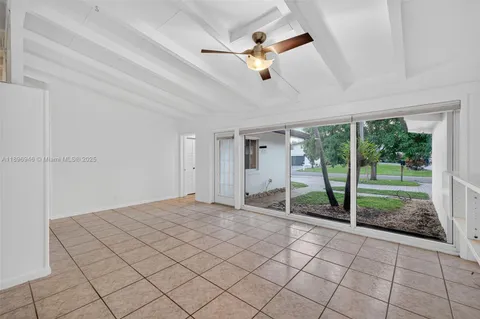 a kitchen with a stove and a wooden floor