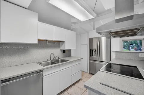 a view of a kitchen with furniture and a kitchen