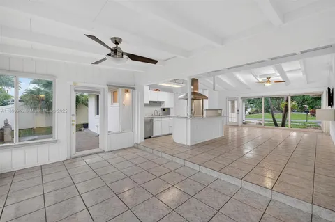 a bathroom with a tub toilet a sink and mirror