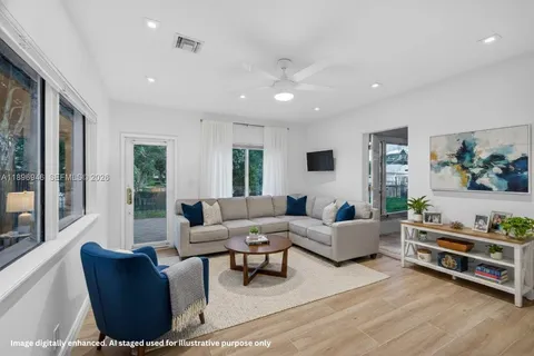 a front view of a house with a garden and yard