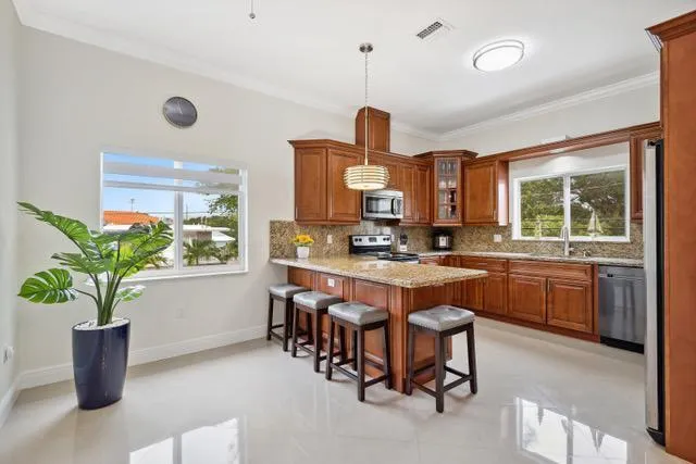 a kitchen with a table and chairs in it