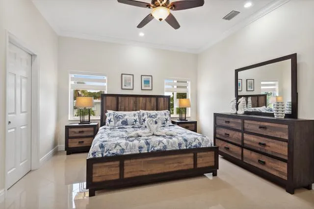 a bedroom with a bed and a dresser