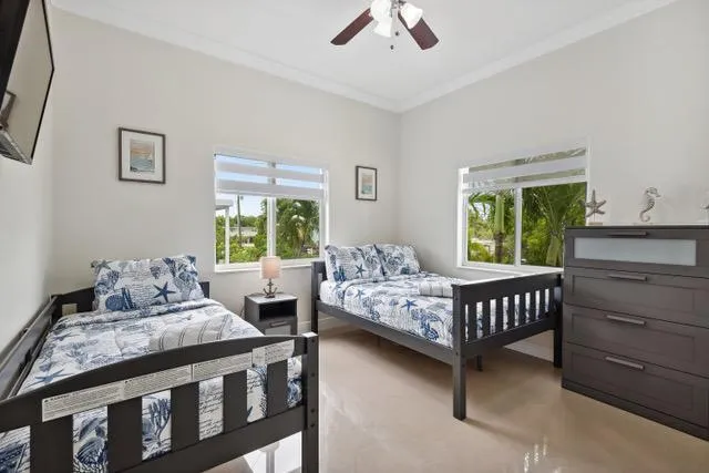 a bedroom with bed and a window