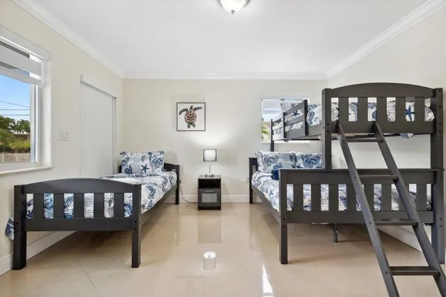 a bedroom with furniture and a window