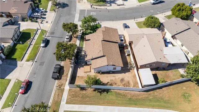 an aerial view of a house with a swimming pool